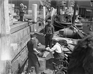 Men Unloading Crates of Rum