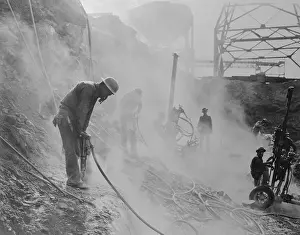 Digging Prints: Men Using Jackhammers During Dam Construction
