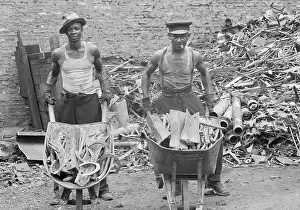 Pile Prints: Two Men W/Wheelbarrows Of Scrap Iron