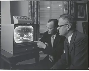 Men Watching TV Broadcast