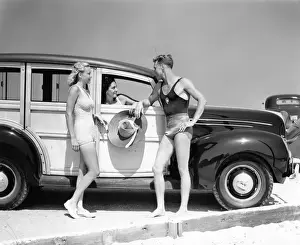 Swimwear Prints: Men & Women In Bathing Suits In Front Of 1938 Ford Wood Body Station Wagon Automobile At Seashore Talking