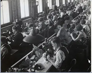 Sewing Prints: Men and Women Sewing in Textile Factory