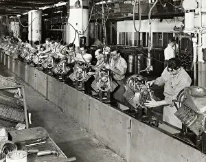 Men Working on Automobile Engine Assembly Line