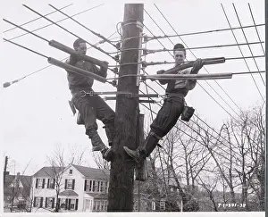 Men Working on Electrical Wires from Poles
