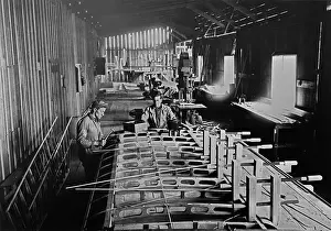 Men Working in Military Aircraft Plant