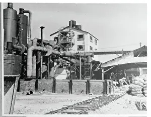 Men Working Near Transporting Railway at Plant