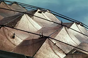 Men Working on Roof of Sports Building