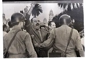 Men Yell in Street and Police Hold Them Back