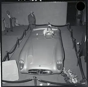 Prints of (Original Caption). Honk! Honk! Model Deedee Reber gets feel of the wheel in a Mercedes Benz SLR racing car Vintage Car Collection Prints: Mercedes Benz SLR Racing Car