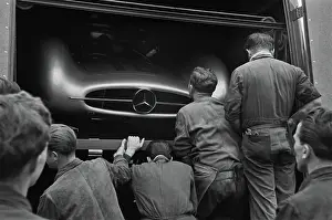 Prints of Mechanics examine Juan Manuel Fangio's W196 Mercedes Benz in the pits at the French Grand Prix in Reims, 4th July 1954 Vintage Car Collection Prints: Mercedes Inspection
