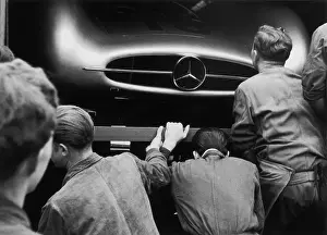 Prints of Mechanics examine Juan Manuel Fangio's W196 Mercedes Benz in the pits at the French Grand Prix in Reims, 4th July 1954 Vintage Car Collection Prints: Mercedes Inspection