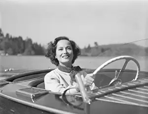Scarf Prints: Merle Oberon Driving a Motorboat