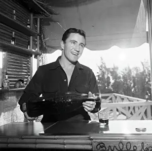 Merv Griffin Pours A Giant Coke Bottle