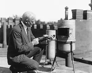 Meteorologist With as Rain Gauge