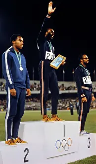 One Hundred Meter Dash Winners Posing on the Podium