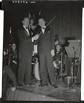 Meyer Davis Passing His Music Baton to His Servant