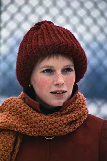 Mia Farrow Preparing to Play Tennis
