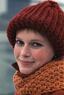 Mia Farrow Preparing to Play Tennis