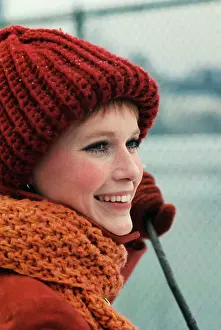 Mia Farrow Preparing to Play Tennis