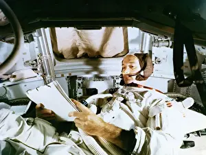 Reentry Module Prints: Michael Collins Studying Flight Plans