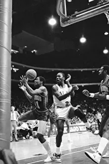 Prints of (Original Caption). Dancing with the ball is Piston's Isaiah Thomas after he fouled Bulls Michael Jordan as Jordan went up to shoot in the second quarter of their game MJ's Iconic Moments: Michael Jordan and Isaiah Thomas in Game Action