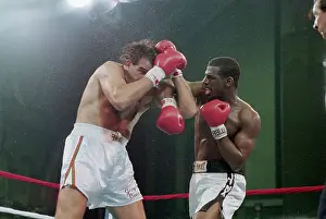Defense Prints: Michael Spinks Punches Cowering Jerry Cooney