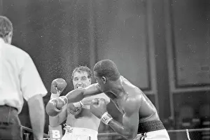 Sweating Prints: Michael Spinks Punches Jerry Cooney