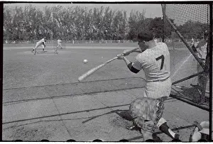 Mickey Mantle in Action to Hit Baseball