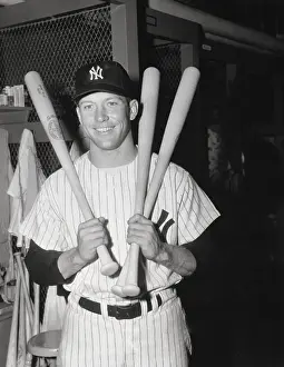 Mickey Mantle Holding Three Bats