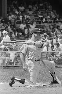 Mickey Mantle Kneeling on Field with Baseball Bat