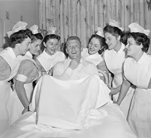 Mickey Mantle Lying in Bed with Nurses Standing Around Him