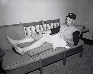 Mickey Mantle Lying on Couch with Covering on Injured Knee