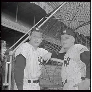 Mickey mantle and Roger Maris Standing Near Net