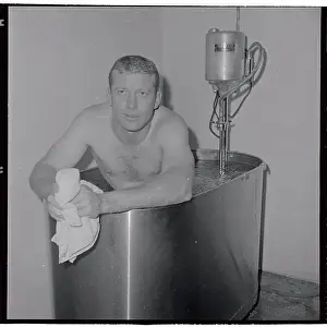 Mickey Mantle Sitting in Hot Tub as Trainer Stands Nearby