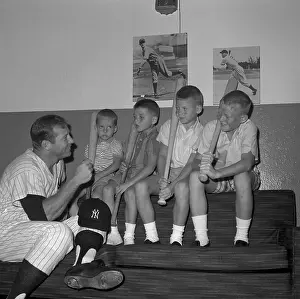Mickey Mantle Stooping to Talk with His children