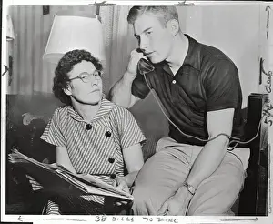 Ottawa County Prints: Mickey Mantle Talking on Telephone Near His Mother