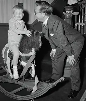 Mickey Rooney Conversing with His Son on Horseback