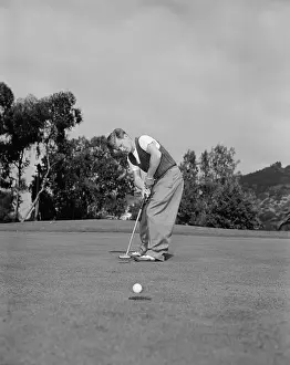 Mickey Rooney Hitting a Golf Ball