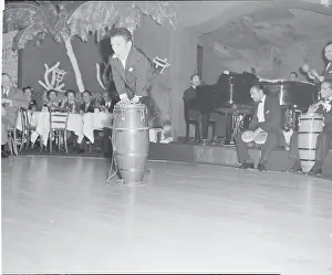 Midget Performing Stage Stunt with Band at the El Morocco