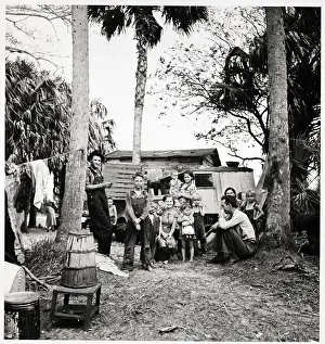 Migrant Laborer In Camp With His Family
