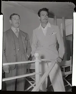 Mike Romanoff and Gilbert Roland Watching Tennis