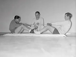 Mildred Didrickson with Johnny Farrell Using Exercise Apparatus