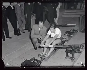 Mildred Didrickson Practicing on Machine with Jack Kelly Alongside