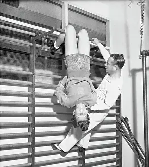 Mildred Didrickson Using Exercise Apparatus with Artie McGovern