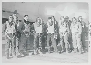 Military Airmen Posing by Airplane