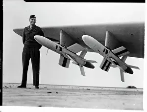 A Military Captain Stands Next to Ryan Firebird Missiles