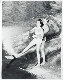 Military Man Taking Young Lady for a Ski Ride