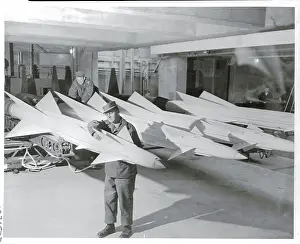 Military Man Working on Horizontal Missile