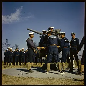Military Men Operating Machine Gun