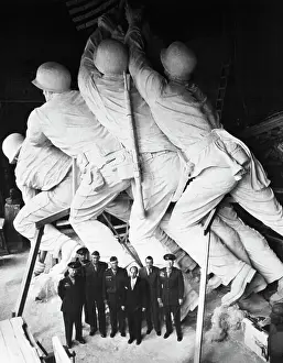 Military Men in Front of Statue